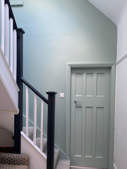 door stairs wall painted black white green