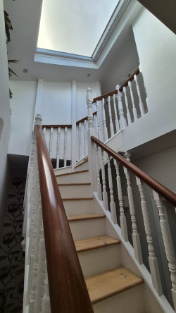 stairs upstairs turning large staircase painted white