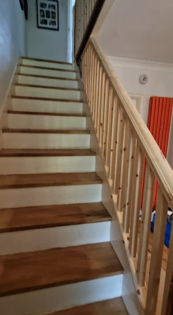 Prepping upstairs banister staircase sanded bare wood before painting