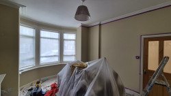 Before mjs painting services painted front room with bay window